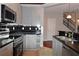 Featuring stainless steel appliances and black tile backsplash, this kitchen is as functional as it is sleek at 400 17Th Nw St # 2412, Atlanta, GA 30363