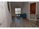 This living room has a high ceiling, ceiling fan, a bright window, and a stylish blue sofa at 400 17Th Nw St # 2412, Atlanta, GA 30363