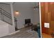 Well-lit living room with hardwood floors, a ceiling fan and a modern staircase at 400 17Th Nw St # 2412, Atlanta, GA 30363
