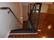 Dark wood staircase leading down to the first level of the home at 400 17Th Nw St # 2412, Atlanta, GA 30363