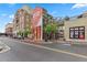 Street view of mixed-use building featuring restaurants, shops, and apartments with sky bridge at 400 17Th Nw St # 2412, Atlanta, GA 30363