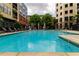 Inviting community pool with lounge chairs and lush landscaping at 400 17Th Nw St # 2412, Atlanta, GA 30363