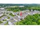 A suburban neighborhood with townhouses, green space and community amenities at 4110 Morgan Elizabeth Way, Cumming, GA 30041