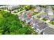 An aerial view of modern townhouses, showcasing the landscaping and green space at 4110 Morgan Elizabeth Way, Cumming, GA 30041