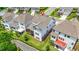 A closer aerial view of a townhouse featuring an outdoor living space at 4110 Morgan Elizabeth Way, Cumming, GA 30041