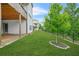 Beautiful, fully-sodded backyard featuring a black aluminum fence and mature tree at 4110 Morgan Elizabeth Way, Cumming, GA 30041