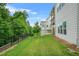 Backyard featuring a black aluminum fence and a wooded tree-lined view at 4110 Morgan Elizabeth Way, Cumming, GA 30041