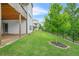 Beautiful, fully-sodded backyard featuring a black aluminum fence and mature tree at 4110 Morgan Elizabeth Way, Cumming, GA 30041