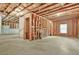Unfinished basement with visible framing, concrete foundation, and a future stairwell at 4110 Morgan Elizabeth Way, Cumming, GA 30041