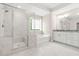 Bright bathroom featuring a glass shower, tub, and double sink with granite countertops at 4110 Morgan Elizabeth Way, Cumming, GA 30041