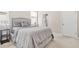 Bedroom with neutral colors, carpet, ample natural light and a bathroom en suite at 4110 Morgan Elizabeth Way, Cumming, GA 30041