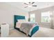 Bright bedroom featuring plush carpet, ceiling fan, storage bed and plenty of natural light at 4110 Morgan Elizabeth Way, Cumming, GA 30041