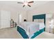 Bright bedroom featuring plush carpet, ceiling fan, storage bed, and closet at 4110 Morgan Elizabeth Way, Cumming, GA 30041