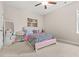 Bedroom with plush carpet, ceiling fan, pink bed frame and plenty of light at 4110 Morgan Elizabeth Way, Cumming, GA 30041