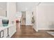 Inviting foyer with hardwood floors, a staircase, and views into adjoining rooms at 4110 Morgan Elizabeth Way, Cumming, GA 30041