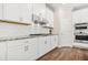 Gourmet kitchen features stainless steel appliances and a granite countertop at 4110 Morgan Elizabeth Way, Cumming, GA 30041