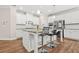 Gourmet kitchen features stainless steel appliances and a granite countertop island at 4110 Morgan Elizabeth Way, Cumming, GA 30041
