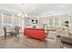 Well-lit living room with modern window coverings, a dining area, and comfortable seating at 4110 Morgan Elizabeth Way, Cumming, GA 30041