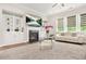 Cozy living room showcases a fireplace, built-in shelving, and comfortable seating at 4110 Morgan Elizabeth Way, Cumming, GA 30041