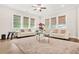 Bright living room featuring two sofas, modern window blinds, and a plush area rug at 4110 Morgan Elizabeth Way, Cumming, GA 30041