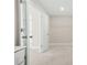 Walk-in closet featuring custom shelving and neutral carpeting at 4110 Morgan Elizabeth Way, Cumming, GA 30041