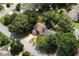 Aerial shot of home, highlighting the mature trees and private fenced backyard at 914 Wenham Ln, Lawrenceville, GA 30044