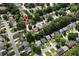 An aerial perspective of a well-maintained neighborhood with mature trees at 914 Wenham Ln, Lawrenceville, GA 30044