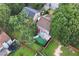 Aerial view of the property featuring the backyard and surrounding mature trees at 914 Wenham Ln, Lawrenceville, GA 30044