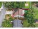 Aerial view showcases home, deck, patio, fenced backyard, and landscaping at 914 Wenham Ln, Lawrenceville, GA 30044