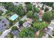 Aerial view highlighting the property's backyard and proximity to the community pool at 914 Wenham Ln, Lawrenceville, GA 30044