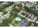 A birds-eye view of a neighborhood with a community pool and mature trees at 914 Wenham Ln, Lawrenceville, GA 30044