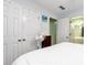 Clean bedroom with access to bathroom, neutral paint, ceiling fan, and ample closet space at 914 Wenham Ln, Lawrenceville, GA 30044