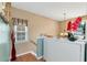 Bright hallway with natural light, white storage cabinets, and decorative accents, creating a cozy atmosphere at 914 Wenham Ln, Lawrenceville, GA 30044