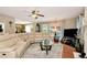 Bright living room with a fireplace, large sectional sofa, and views into the dining area at 914 Wenham Ln, Lawrenceville, GA 30044