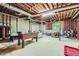 Unfinished basement space offers foosball table, drum set, and plenty of possibilities at 110 Boulder Dr, Roswell, GA 30075
