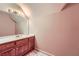 Standard bathroom featuring a sink, tile floors, and a large mirror at 110 Boulder Dr, Roswell, GA 30075