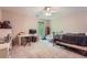 Bedroom featuring carpet, a ceiling fan, and a bright window overlooking the backyard at 110 Boulder Dr, Roswell, GA 30075