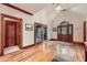 Inviting foyer with hardwood floors, high ceilings, and an elegant front door, radiating warmth and character at 110 Boulder Dr, Roswell, GA 30075
