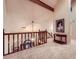 A second story view of the foyer and front door with lots of natural light at 110 Boulder Dr, Roswell, GA 30075