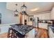 Modern kitchen featuring granite countertops, stainless steel appliances, island cooktop, and ample storage at 110 Boulder Dr, Roswell, GA 30075