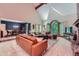 Bright living room with a vaulted ceiling, large window, and cozy seating with a fireplace, perfect for relaxing at 110 Boulder Dr, Roswell, GA 30075