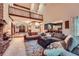 Spacious open living room with a brick fireplace, balcony view, seamlessly blending space and elegance at 110 Boulder Dr, Roswell, GA 30075