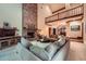 Open living room features high ceilings, a brick fireplace, and a balcony view, offering a blend of space and style at 110 Boulder Dr, Roswell, GA 30075
