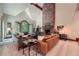Cozy living room with a brick fireplace, vaulted ceiling and plush seating, perfect for Gathering gatherings at 110 Boulder Dr, Roswell, GA 30075