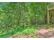View of the wooded yard from the wooden deck. Serene setting at 110 Boulder Dr, Roswell, GA 30075
