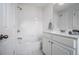 All-white bathroom with tub, shower, and vanity at 1935 Cobblestone Ne Cir, Brookhaven, GA 30319