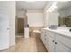 Bathroom with double sinks, a shower, and a bath tub at 1935 Cobblestone Ne Cir, Brookhaven, GA 30319