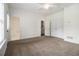 Spacious bedroom with neutral carpet, white trim, ceiling fan and easy access to the ensuite bathroom at 1935 Cobblestone Ne Cir, Brookhaven, GA 30319