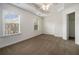Bright bedroom with plush carpet, ceiling fan and large window at 1935 Cobblestone Ne Cir, Brookhaven, GA 30319