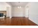 Dining area features hardwood floors, stone fireplace, and decorative wall trim at 1935 Cobblestone Ne Cir, Brookhaven, GA 30319